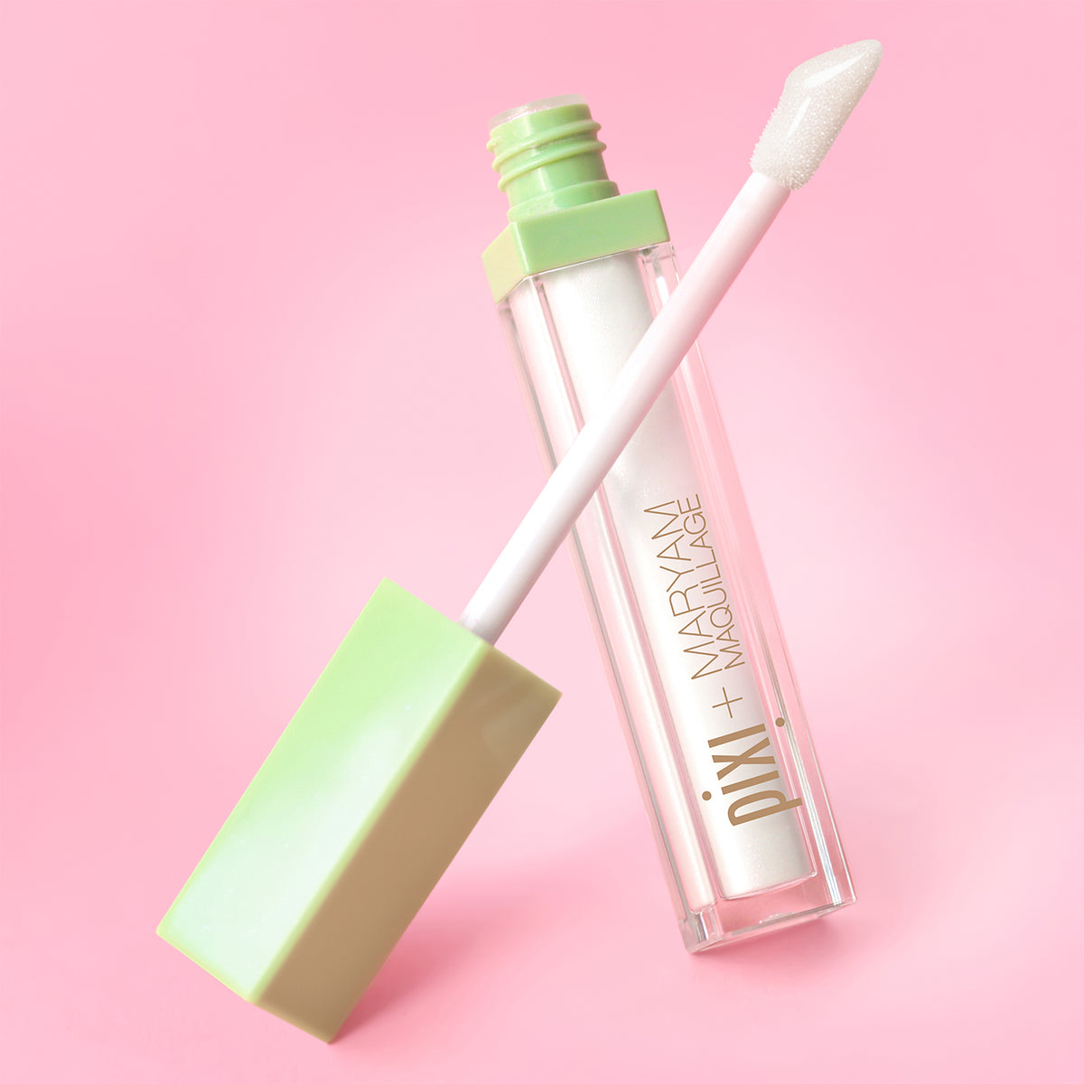 Maryam Maquillage Makeup product with green cap and white body on a pink background