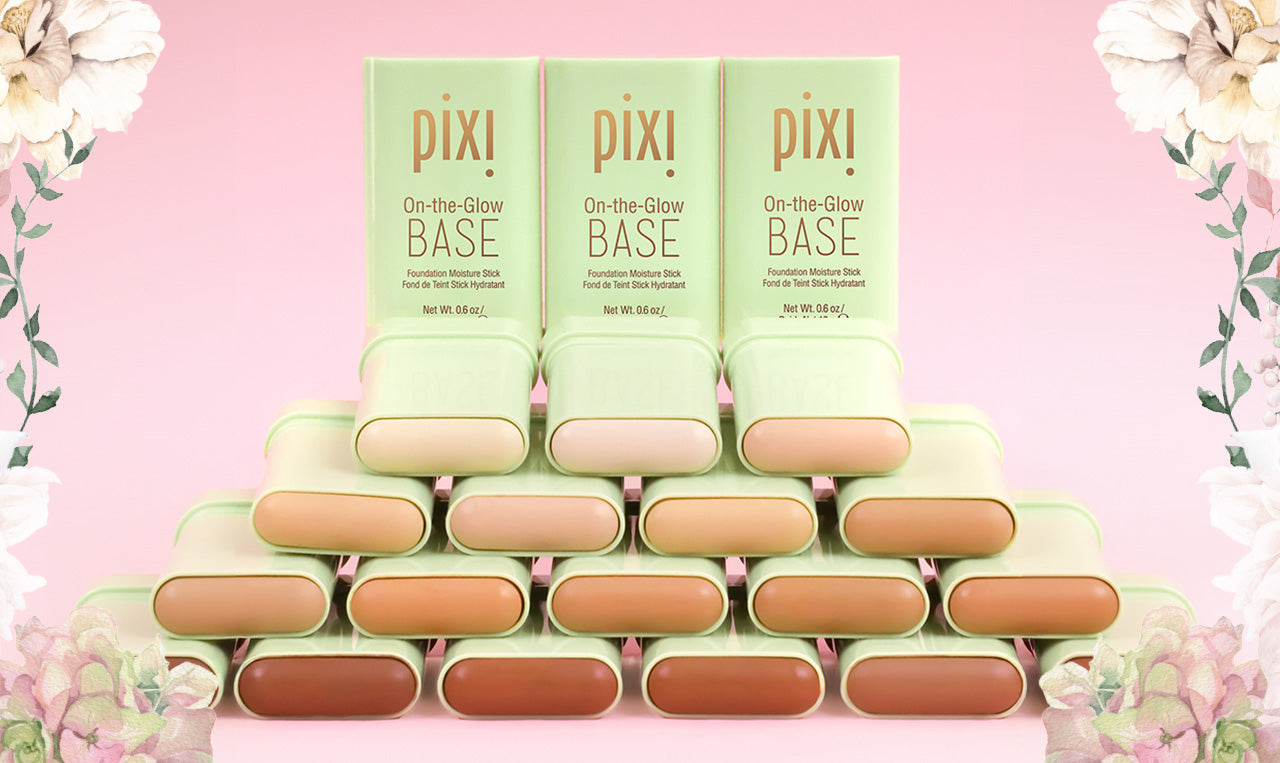 Multiple shades of On-the-Glow Base on a pink background and floral design border
