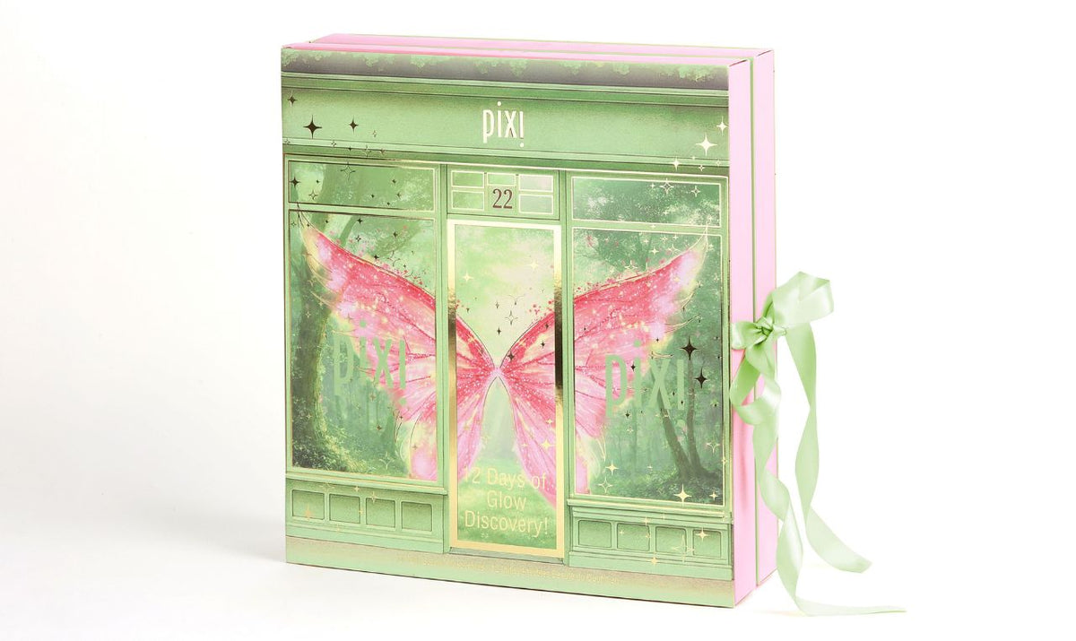 Pixi Beauty Glow Discovery Advent Calendar in a decorative green and pink fairy-tale house box with a pink butterfly illustration, tied with a mint green ribbon.