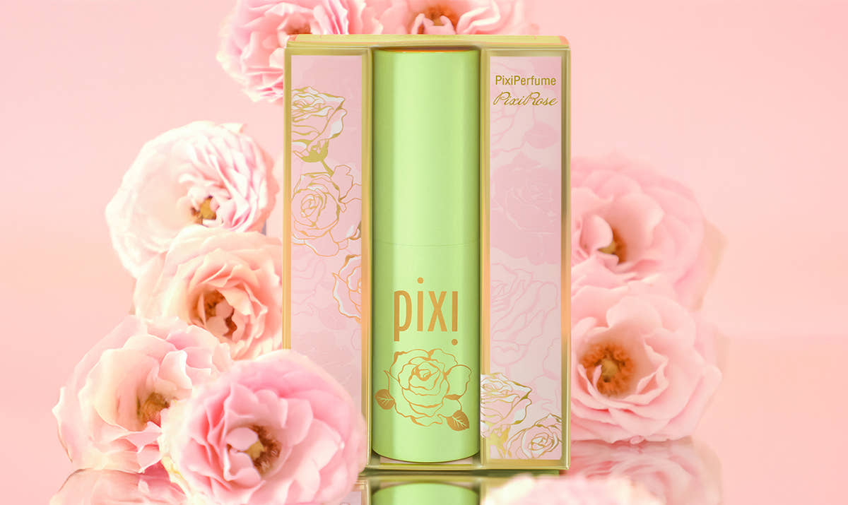 PixiPerfume PixiRose on a pink background with roses
