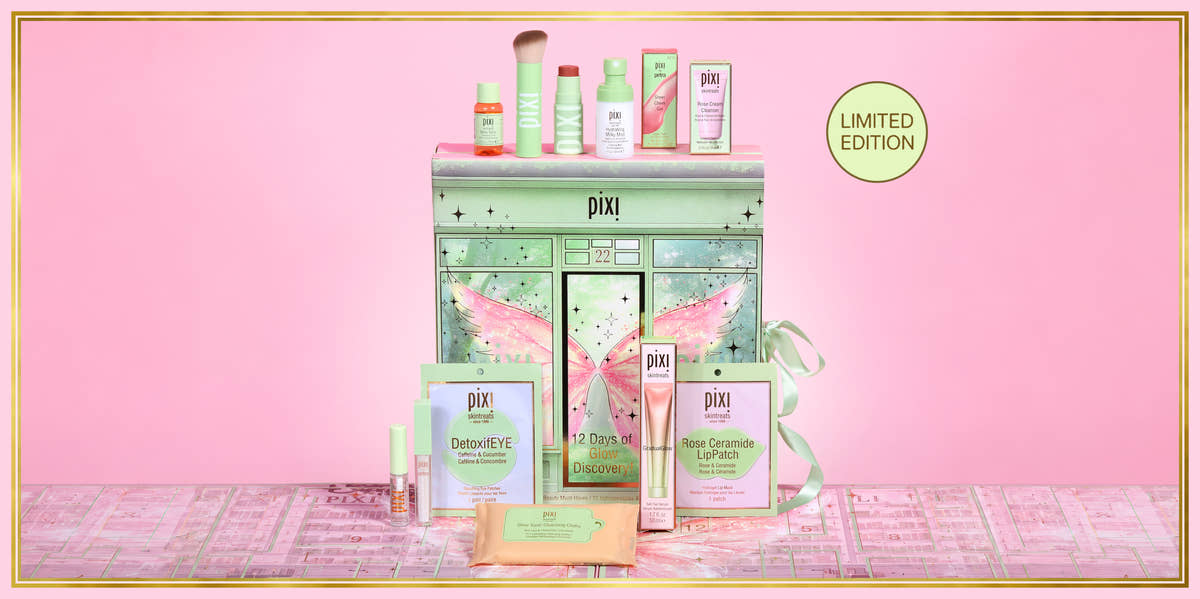 Pixi Advent Calendar gift set displayed on a pink background, featuring a mint green fairy-themed trunk with pink wings, surrounded by skincare and makeup products including DetoxEYE, Rose Ceramide LipPatch, and a small bottle, with a 'LIMITED EDITION' badge. View 2