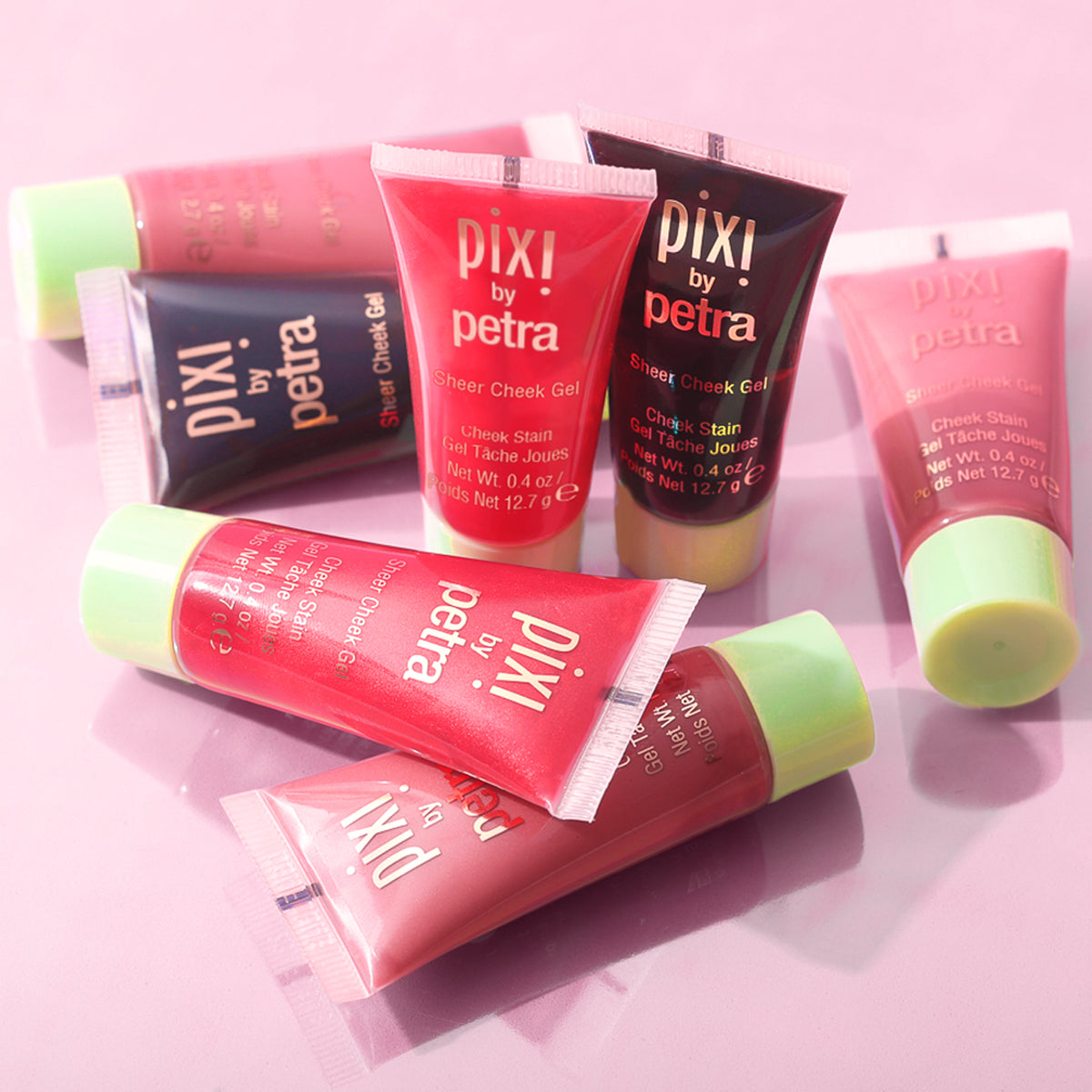 Pixi by Petra Sheer Cheek Gel Cheek Stain on a pink background