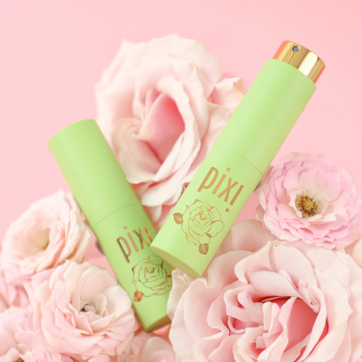 PixiPerfume PixiRose two bottles with pink background and roses