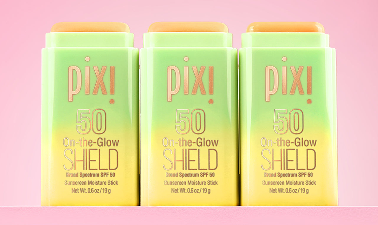 4 bottles of On-the-Glow SHIELD shown on a pink background - View 1