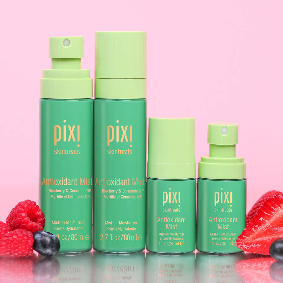 Antioxidant Mists in multiple sizes shown on a pink background with berries view 1