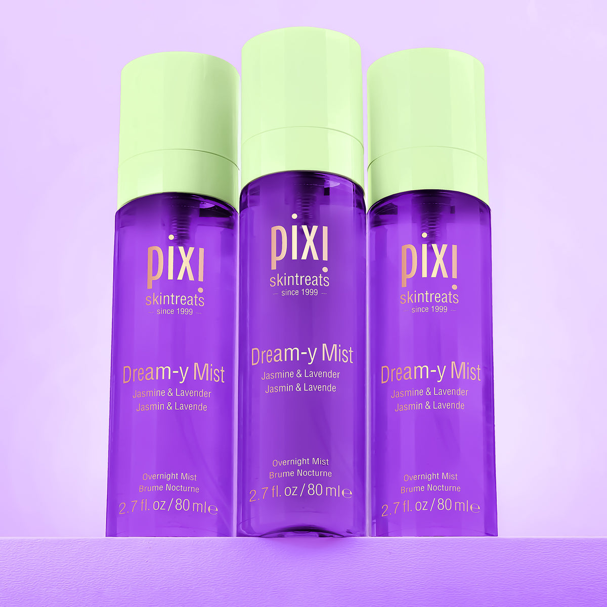 Three bottles of Pixi Dream-y Mist on a purple background