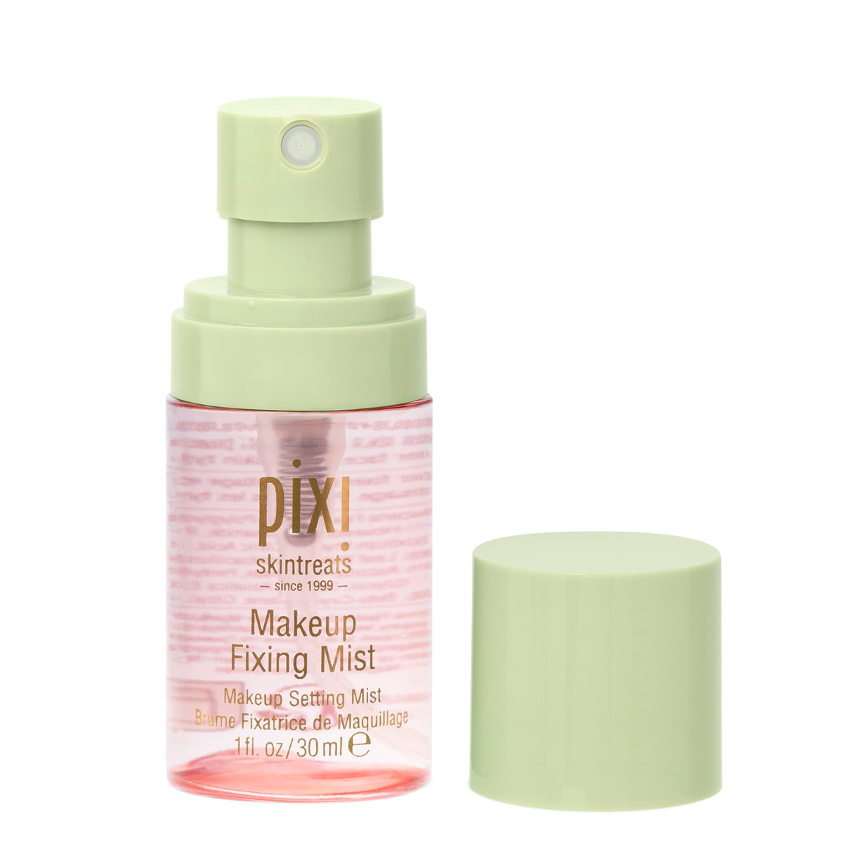 Pixi Skintreats Makeup Fixing Mist in a clear bottle with a pale green spray pump, shown next to its matching light green cap on a white background.